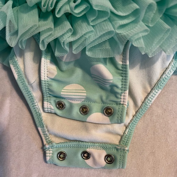 Toddler girls bathing suit. Snap closure at bottom. Ruffle/tutu on waist & arms - Picture 3 of 3